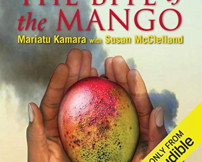 Cover of the book "The Bite of the Mango" by Mariatu Kamara and Susan McClelland. Translucent hands holding a mango with a village background