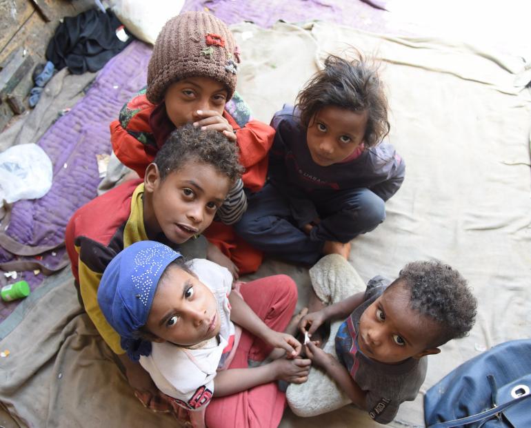 A photo of Noora, Abdullah, Faraj, Hind and Remas, all are Ali Mohammed’s children gathered together under the house they have fled to after beingg displaced from their house and land due to the war and conflict in Yemen.