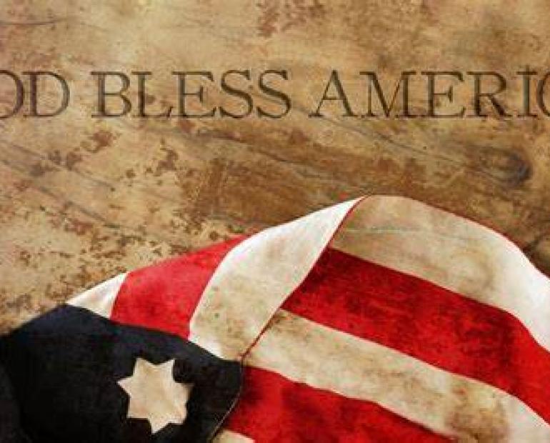 picture of American flag with the words "God Bless America" placed on top of it.