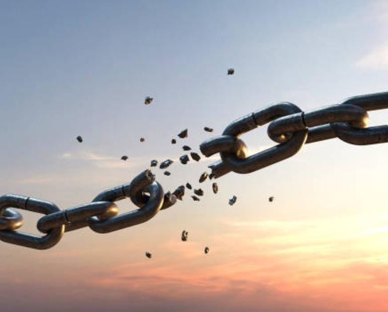 Chain that is torn at sunset