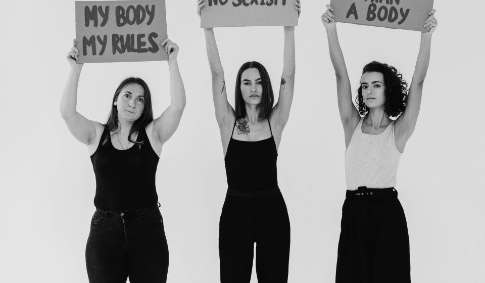 Women Holding Signboards saying: "my body, my rules", "no sexism", and "I am more than a body".