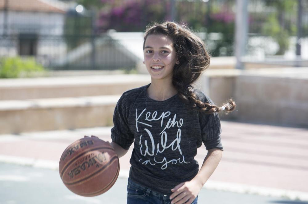 A girl playing basketball