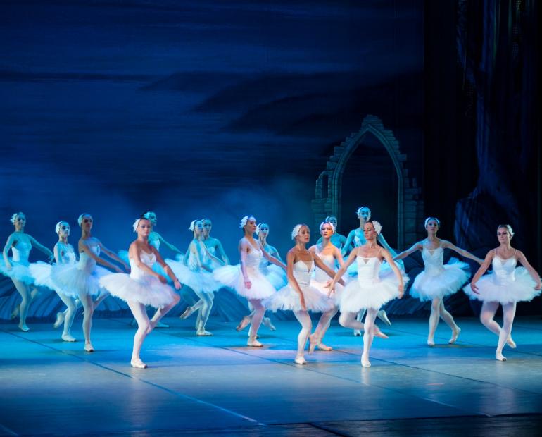 A group of ballerinas on a stage.