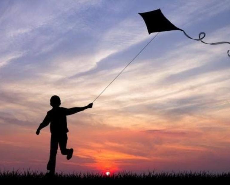Kid playing kite