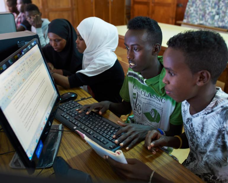 Two young people use a computer at a local community center in Quatier 4 in Djibouti City.