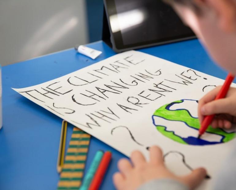 On 7 February 2020, a young boy takes part in a lesson about climate change and environmental activism at Craigentinny Primary School in Edinburgh, Scotland. As a creative task in this lesson, the teacher asks her pupils to create their own protestsigns. This pupil writes, “THE CLIMATE IS CHANGING WHY AREN’T WE?”