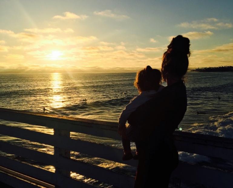 This is an image of my little cousin and I looking at the ocean. I was 17 and she was 3. We have a strong, loving bond like sisters. She's the little sister I've always dreamt of having. 