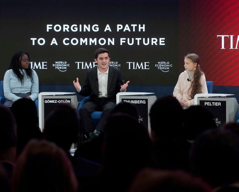 Salvador Gómez-Colón speaking at the World Economic Forum alongside Greta Thunberg, Autumn Peltier, and Natasha Mwansa.