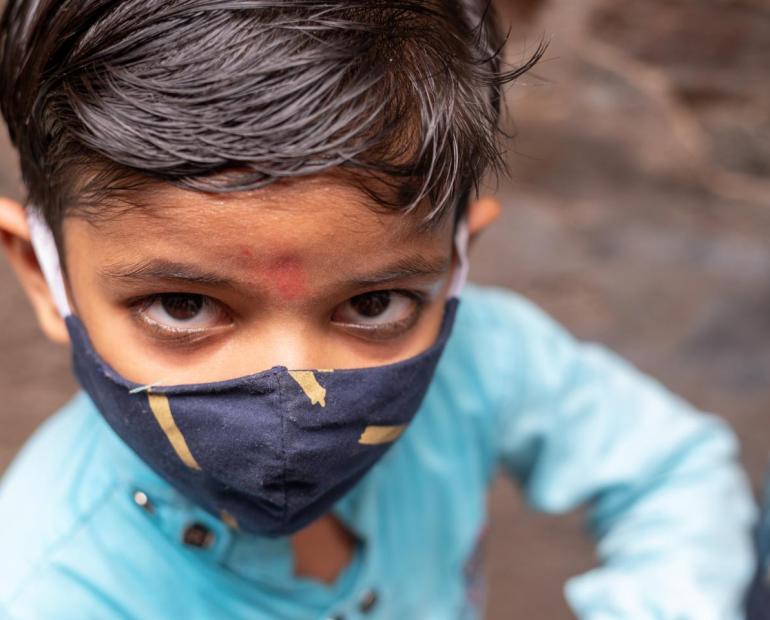 Child in India wearing a mask