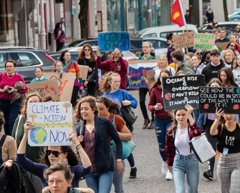 A group of people marching for Climate Change