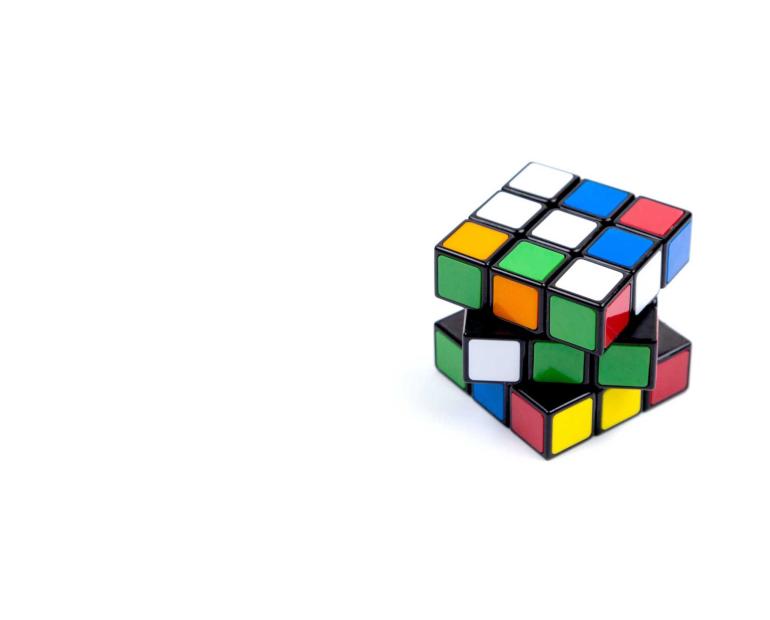 A picture of Rubik cube, with some of its parts shifter in different positions.