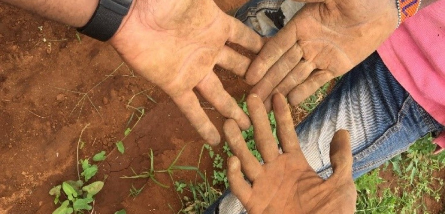 Hands with soil on them