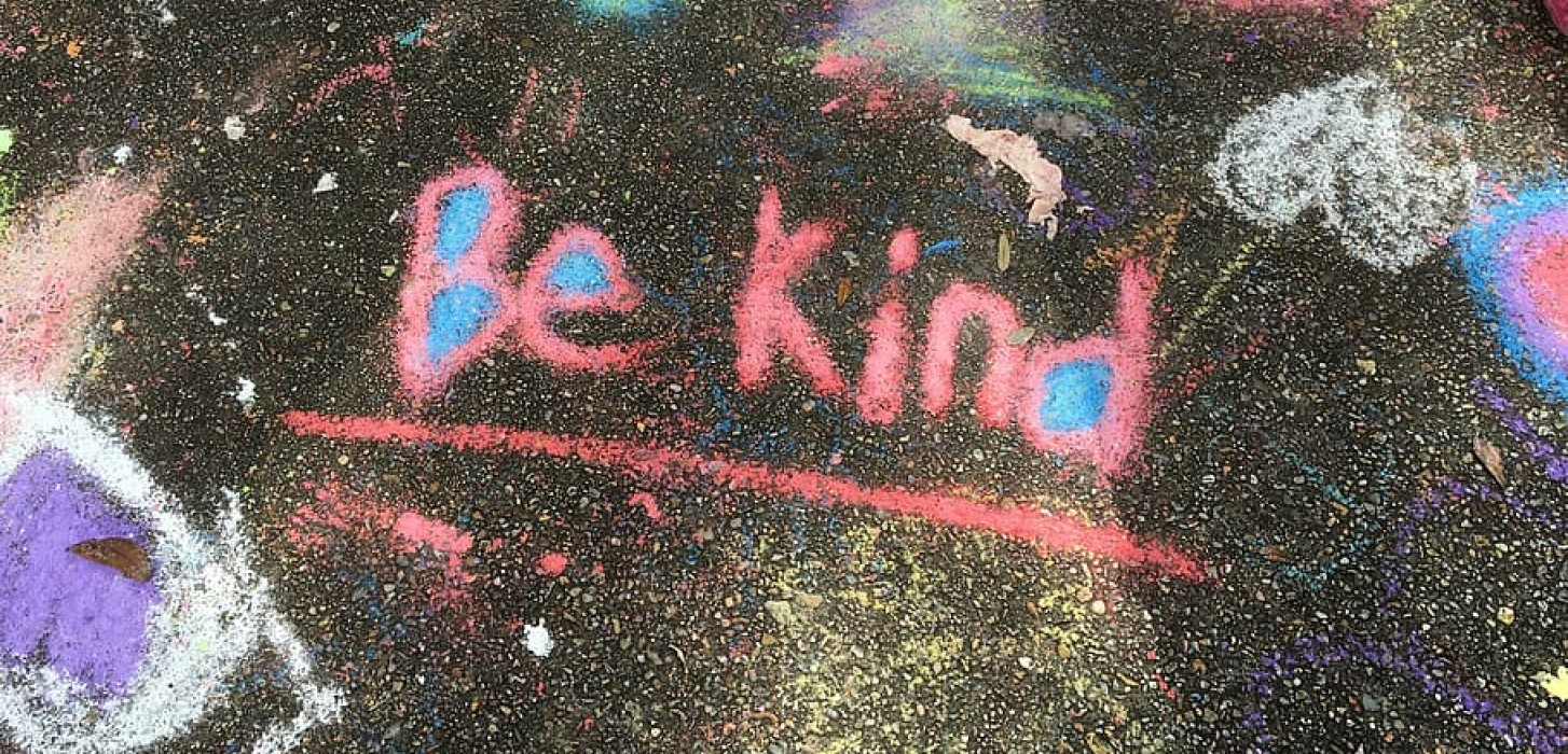 "Be Kind" written in chalk