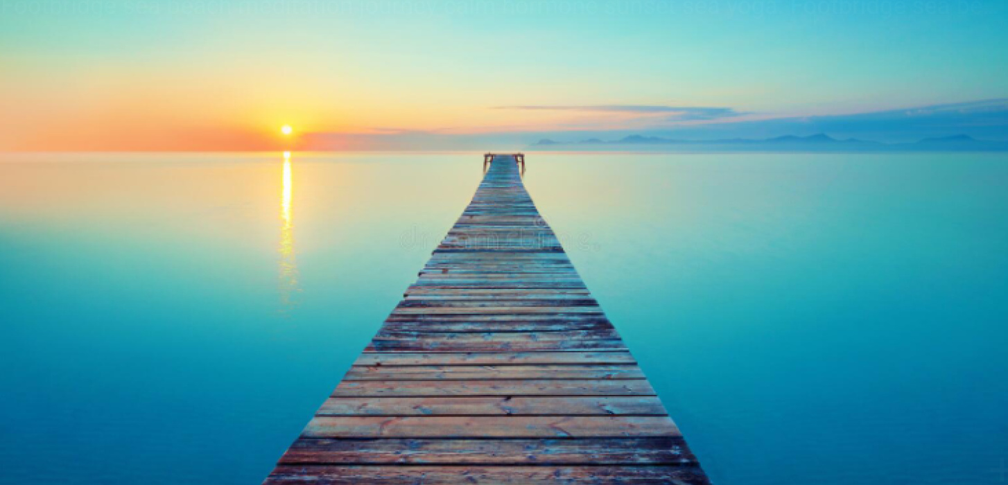 A board walk in a light blue ocean, above a light blue and yellow sky, with the sun to the west