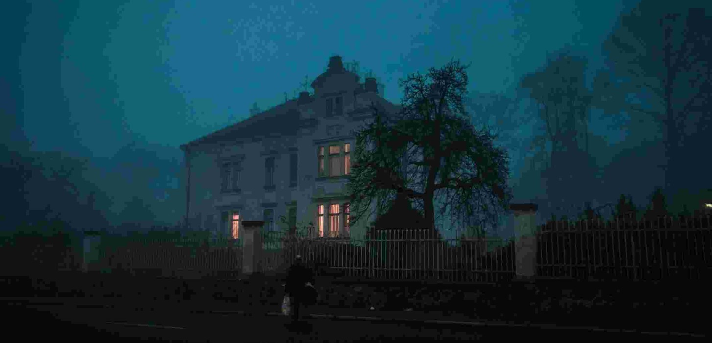 An old, eerie house at night.