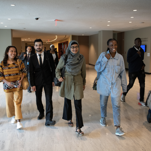 NICEF Goodwill Ambassador Vanessa Nakate (front, second from right), Ugandan youth climate activist Davis Reuben Sekamwa (walking behind, second from right), and UNICEF Youth Advocates visit United Nations Headquarters in New York to meet with Selwin Hart, Special Adviser to the UN Secretary-General on Climate Change and Just Transition.
