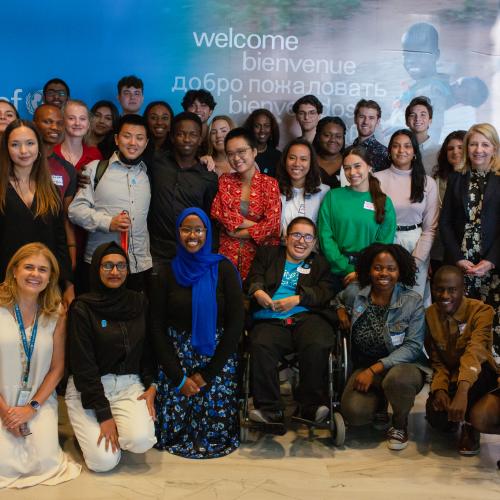 Youth advocates pose with Uni and UNICEF Executive Director Catherine Russell at UNICEF house.