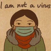 A woman with a mask. The image includes the phrase "I am not a virus"