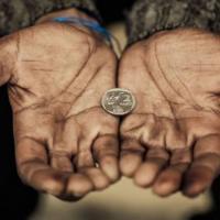A coin in Poor's hand.