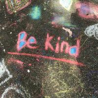 "Be Kind" written in chalk