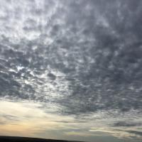 An image of a moody sky with mottled clouds