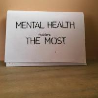 The picture of a sign that says "mental health matters the most"