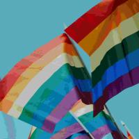 LGBTQI+ flags waving.