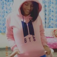 This is an image of me wearing BTS hoodie of pink colour.