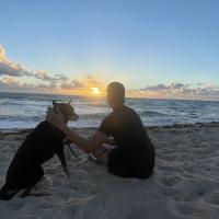 Image of me and a dog I met at the beach, Stitch.