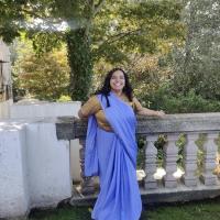 shweta laughing softly in a light purple saree 